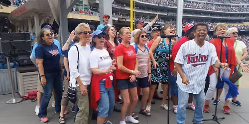 Leading the singing of 'Take Me Out to the Ballgame' at the Minnesota Twins
