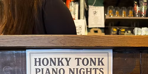 Dr. Busker on the Piano