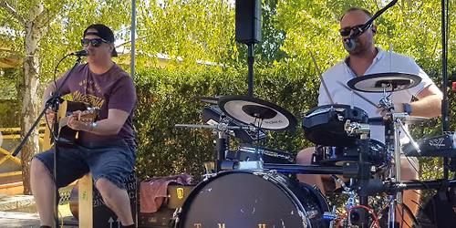 THE MARTINI HENRYS on the front green!