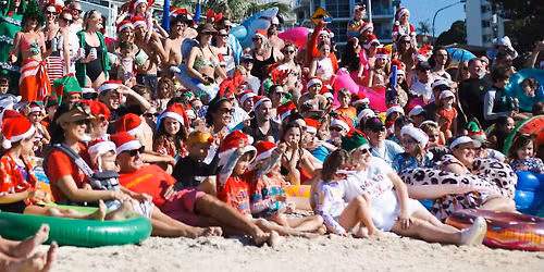 Annual Surfing Santas and Inflatable Toys Event at Rainbow Bay