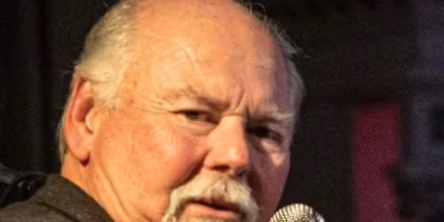 Tom Cawcutt Sr. on the Piano