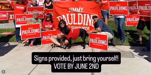 Sign waving for Jimmy Paulding