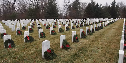 Placing wreaths on headstones at Camp Butler