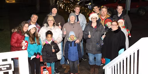 Carolling door to door through SEED neighborhood