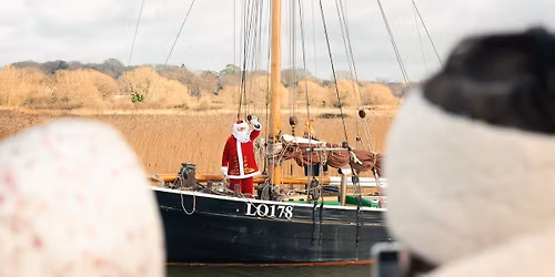 Father Christmas sails into Snape Quay 