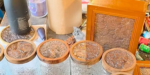 Copper embossed cocoa jars at The Vineyard at Hershey