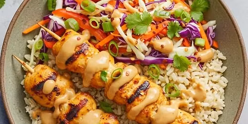 Cork 'N' Fork - Chicken skewers with homemade peanut sauce, jasmine rice, & Asian slaw 