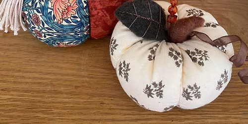Fabric pumpkins with crafty accents