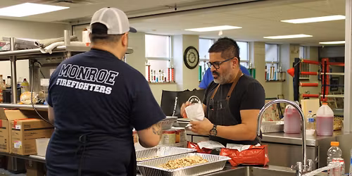 Monroe City Firefighters present Thanksgiving Dinner