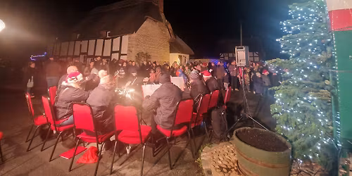 Offenham Christmas Carols around the maypole