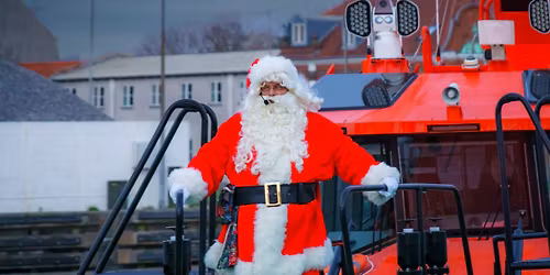 Julemandens ankomst og vække nisserne i tårnet.