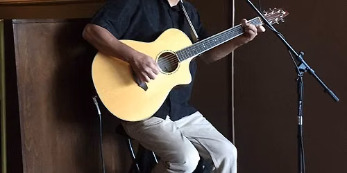 Steve Ono plays guitar