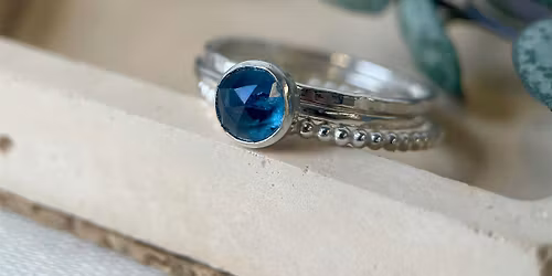 Stacking gemstone and sterling silver rings.