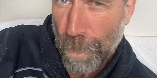 Tony Law \u2013 Alberta Boy!: With an old timey hat and some type of glove.