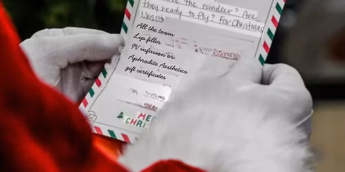 Selfies with Santa at Aphrodite Aesthetics & Wellness